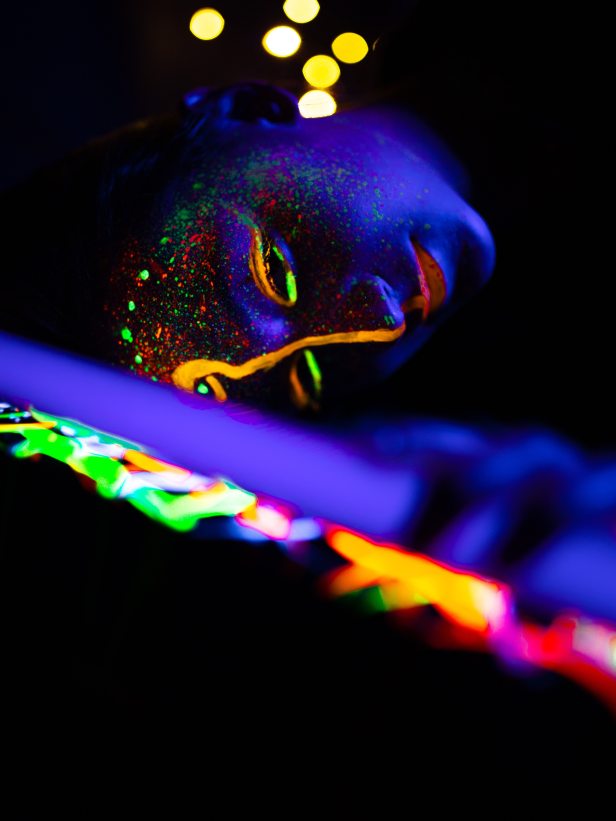 person-wearing-glow-in-the-dark-makeup-3196535